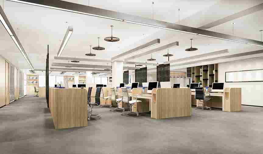 Modern office interior renovation in Romford featuring organized workstations, wooden partitions, ergonomic chairs, and bright, airy lighting.